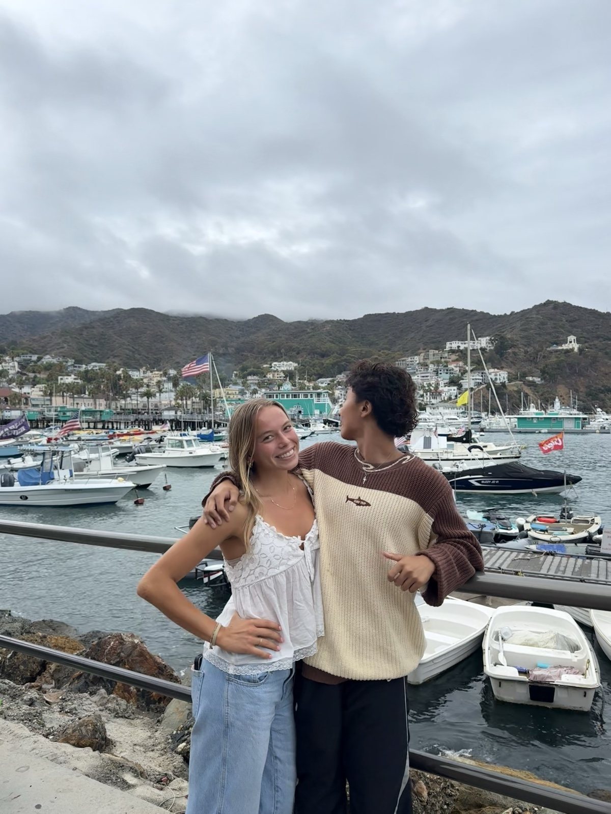 Francis Ruan and a friend at a harbour in Catalina