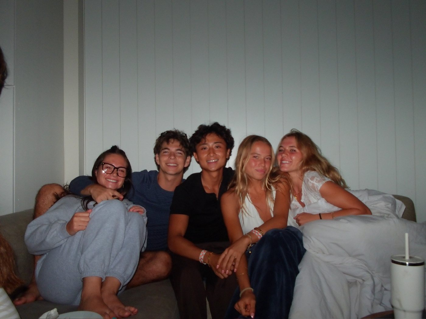 Friends crowded onto a couch